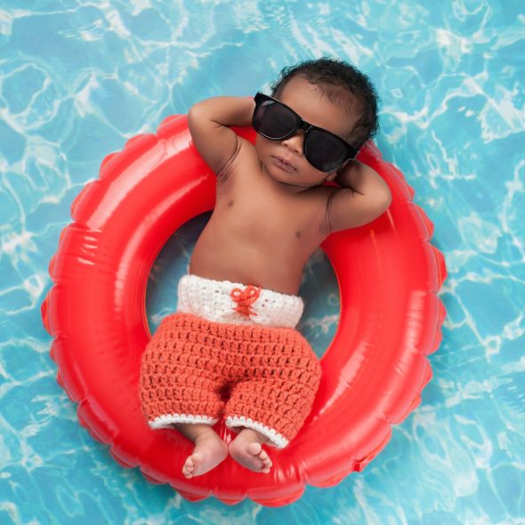BOY FLOATING IN POOL SMALLER