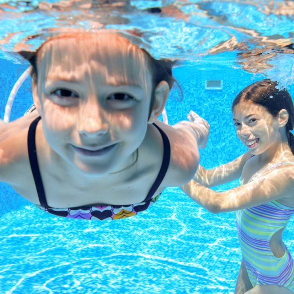 TWO LITTLE GIRLS SWIMMING